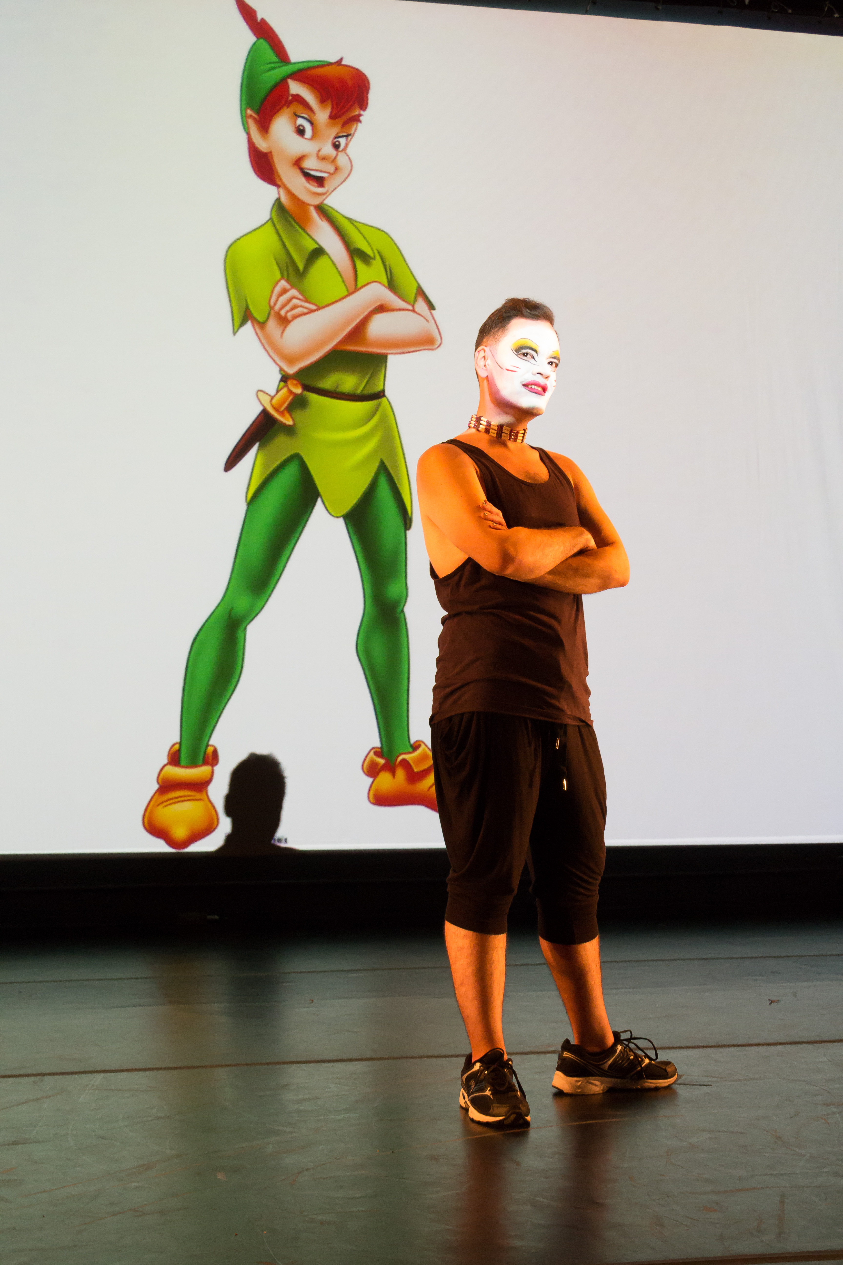 Artist standing in front of image of Peter Pan