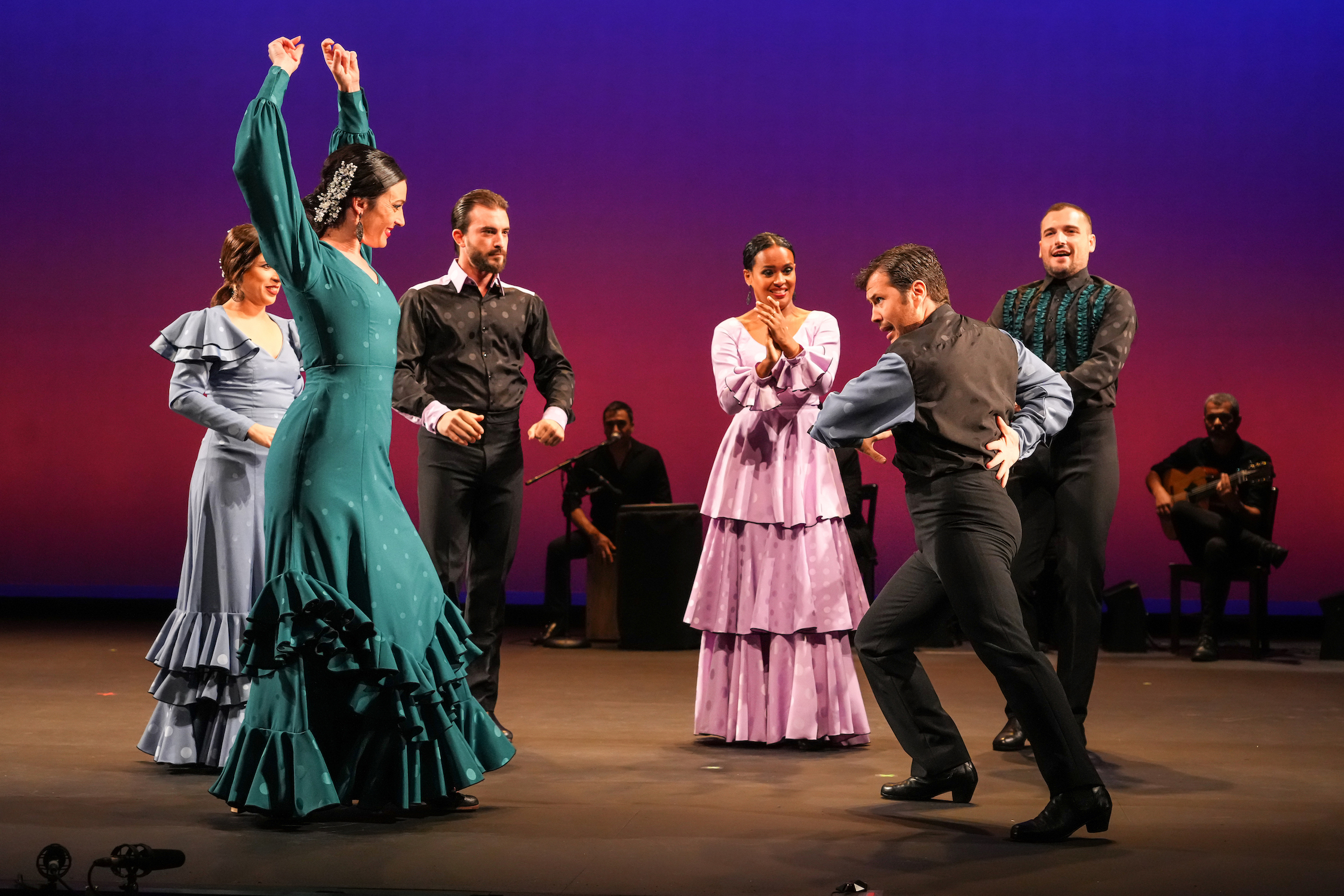 Flamenco dancers and musicians on stage