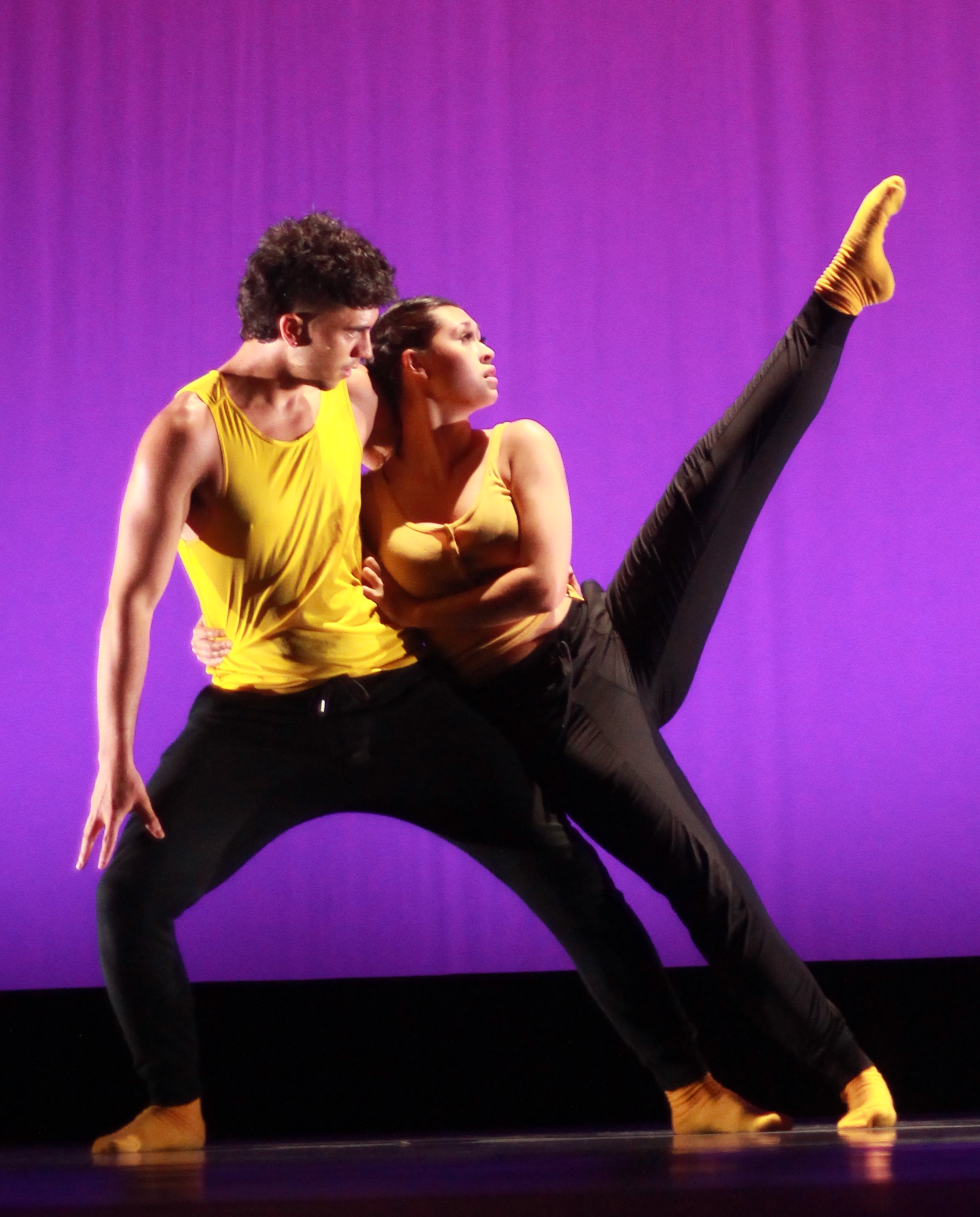 Two dancers performing on stage in Dance Collective 2023 show